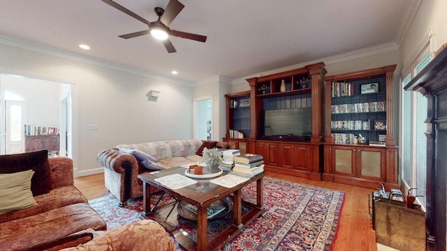 living area with recessed lighting, crown molding, light wood-style floors, and a ceiling fan