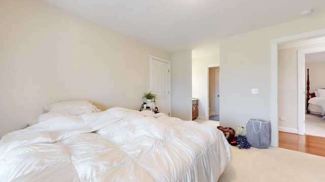 bedroom with light colored carpet