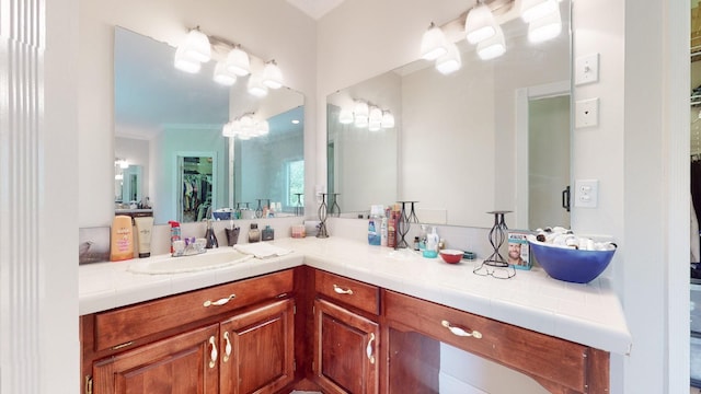 bathroom featuring vanity and crown molding