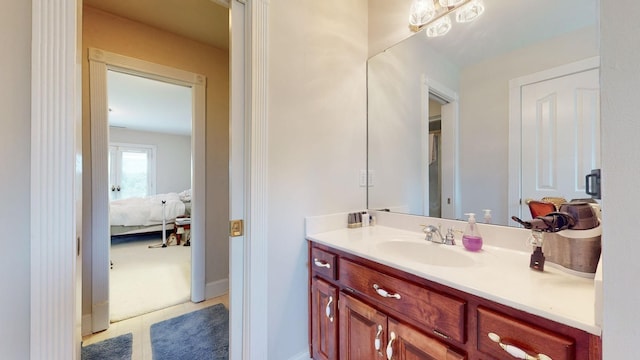 ensuite bathroom featuring ensuite bath and vanity