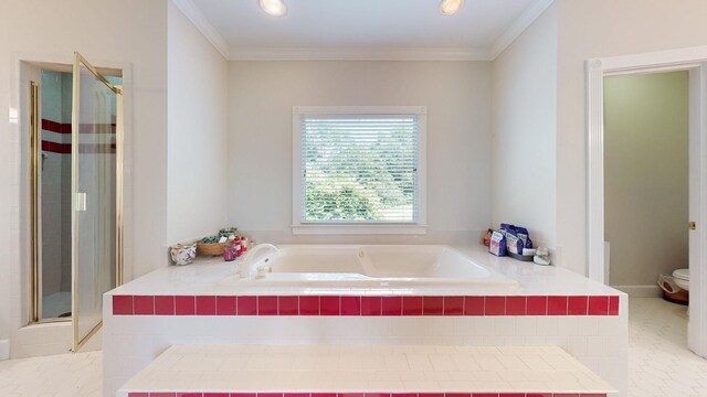 bathroom with a bath, a stall shower, toilet, and crown molding