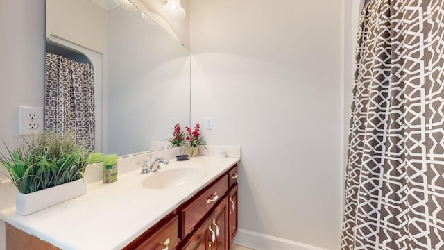 bathroom featuring vanity and baseboards