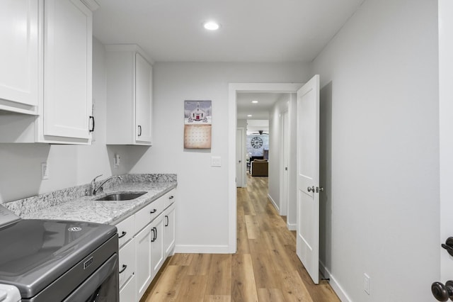 744 Dobbins Pike, Gallatin, TN 37066 - kitchen featuring range, a sink, white cabinetry, baseboards, and recessed lighting