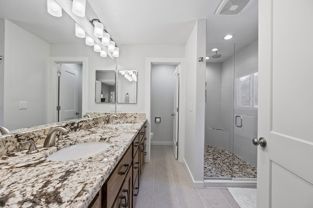 744 Dobbins Pike, Gallatin, TN 37066 - bathroom featuring double vanity, a shower stall, baseboards, tile patterned flooring, and recessed lighting
