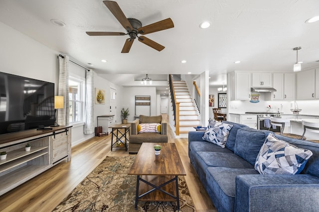744 Dobbins Pike, Gallatin, TN 37066 - living area featuring stairway, light wood finished floors, a ceiling fan, recessed lighting, and baseboards