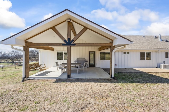 744 Dobbins Pike, Gallatin, TN 37066 - rear view of property featuring board and batten siding, a patio area, central AC unit, and roof with shingles