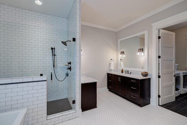 209 Gilchrist S Cir, Nolensville, TN 37135 - bathroom with a shower stall, vanity, washer and dryer, a bath, and crown molding