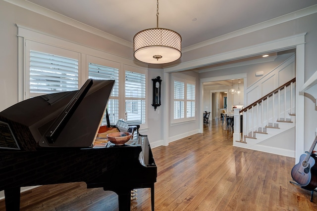 209 Gilchrist S Cir, Nolensville, TN 37135 - sitting room featuring stairway, baseboards, wood finished floors, ornamental molding, and a chandelier