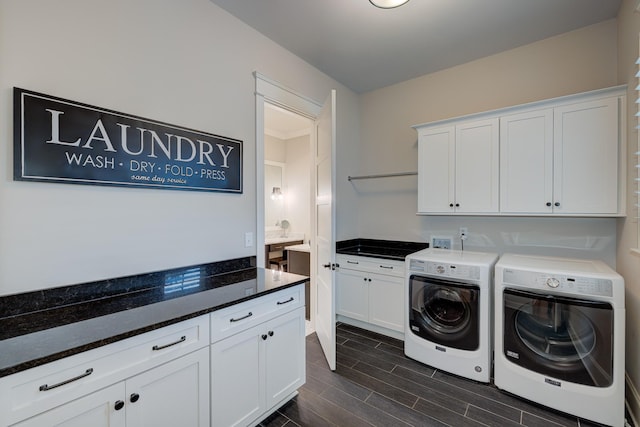 209 Gilchrist S Cir, Nolensville, TN 37135 - laundry room featuring independent washer and dryer, cabinet space, and wood finish floors