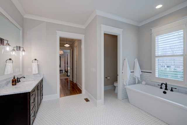 209 Gilchrist S Cir, Nolensville, TN 37135 - full bathroom with crown molding, vanity, a freestanding tub, healthy amount of natural light, and toilet