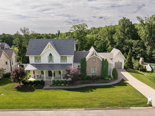 209 Gilchrist S Cir, Nolensville, TN 37135 - modern farmhouse style home with a porch, a standing seam roof, a front lawn, and a garage
