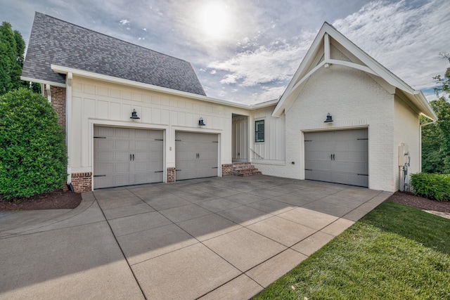 209 Gilchrist S Cir, Nolensville, TN 37135 - view of front of house with brick siding, a garage, concrete driveway, roof with shingles, and board and batten siding