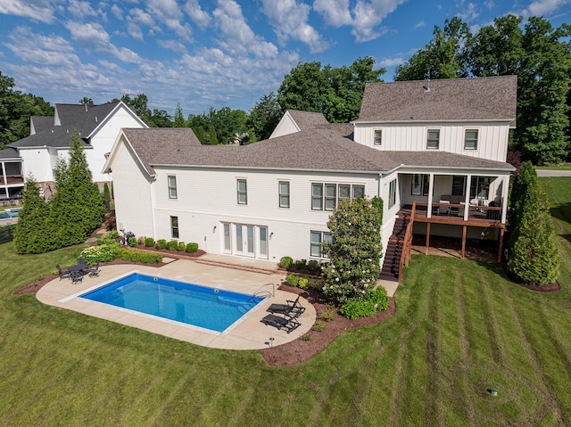 209 Gilchrist S Cir, Nolensville, TN 37135 - rear view of property featuring french doors, a patio, a lawn, and an outdoor pool