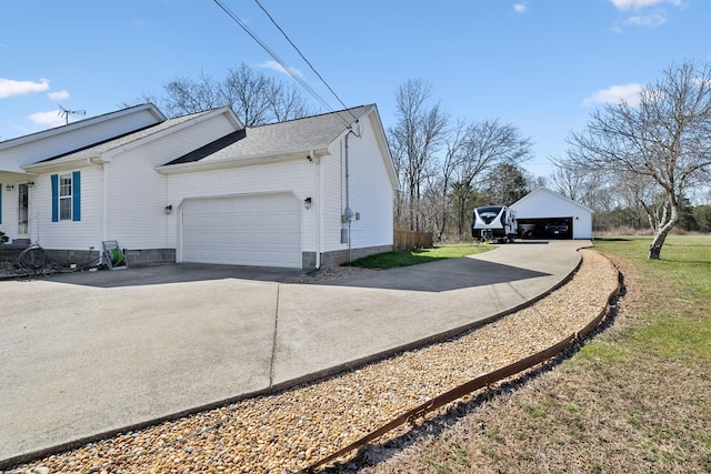 view of side of home featuring concrete driveway and a garage
