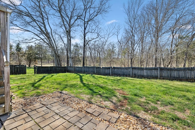 view of yard featuring a patio area and a fenced backyard