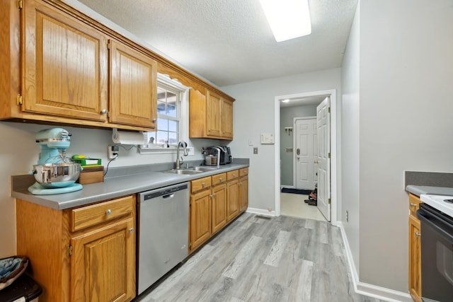 kitchen featuring light wood finished floors, electric range oven, a sink, a textured ceiling, and dishwasher