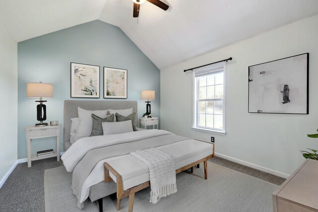 carpeted bedroom featuring lofted ceiling, baseboards, and ceiling fan