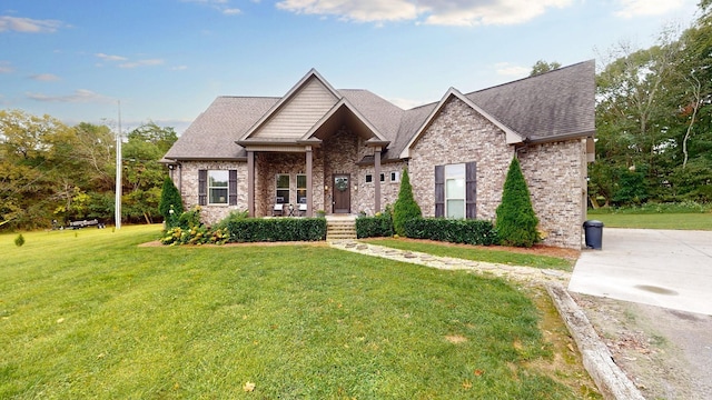 1945 Mann Rd, Lebanon, TN 37087 - craftsman-style home featuring a front yard, a shingled roof, and brick siding
