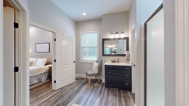 1945 Mann Rd, Lebanon, TN 37087 - bathroom with wood finished floors, connected bathroom, vanity, baseboards, and an enclosed shower