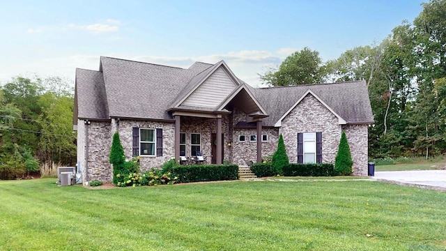 1945 Mann Rd, Lebanon, TN 37087 - craftsman house featuring central air condition unit, a front yard, brick siding, and roof with shingles