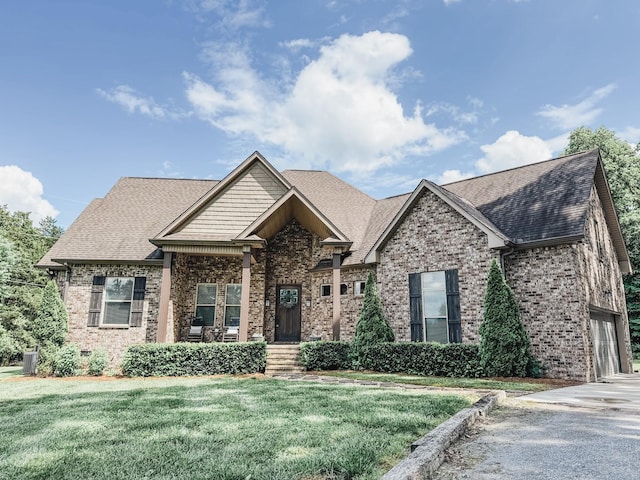 1945 Mann Rd, Lebanon, TN 37087 - craftsman-style house featuring brick siding, a front lawn, roof with shingles, and central air condition unit