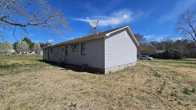 view of side of home with crawl space