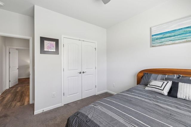 carpeted bedroom featuring a closet, baseboards, and a ceiling fan