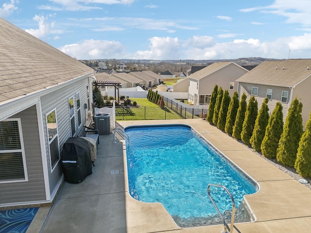 view of pool with a fenced in pool, a fenced backyard, central air condition unit, a lawn, and a residential view