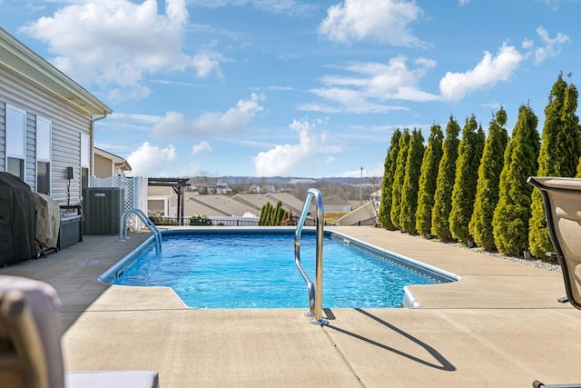 view of pool with a patio area, area for grilling, a fenced in pool, and a water slide