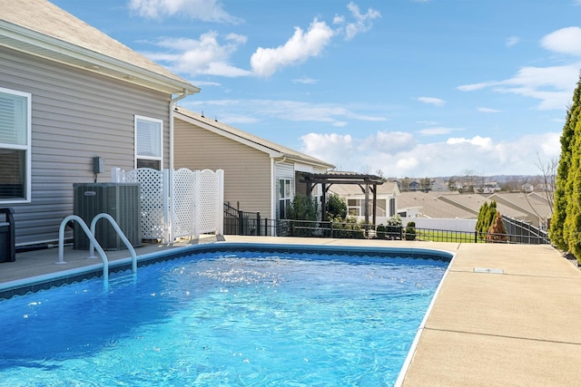 view of swimming pool with a fenced backyard, a fenced in pool, a pergola, and central AC