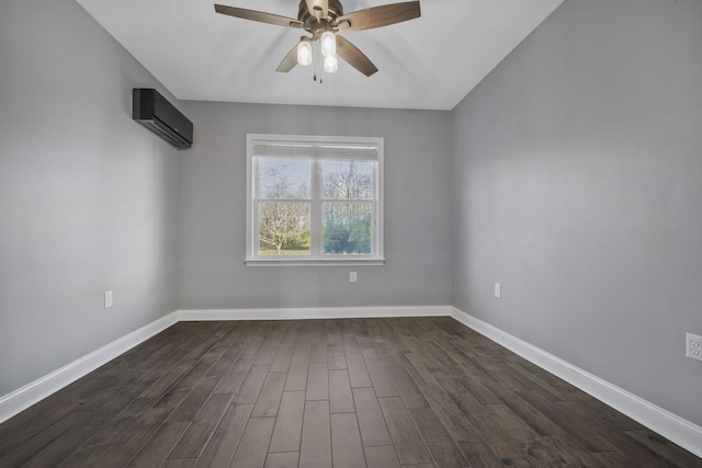 unfurnished room featuring ceiling fan, baseboards, an AC wall unit, and dark wood-style floors