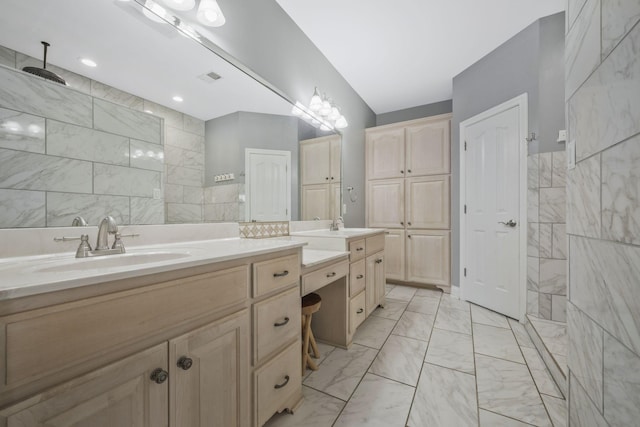bathroom with visible vents, marble finish floor, a sink, double vanity, and walk in shower