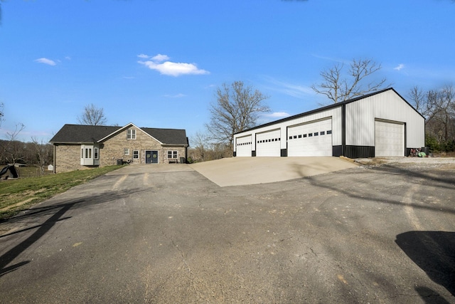 view of front of house with an outdoor structure and a garage