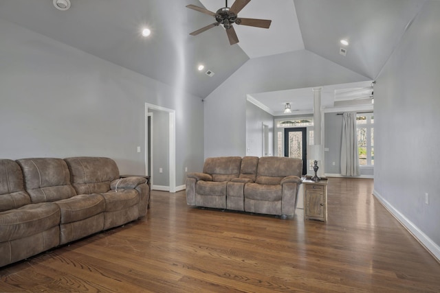 living room with baseboards, high vaulted ceiling, dark wood-style flooring, and a ceiling fan