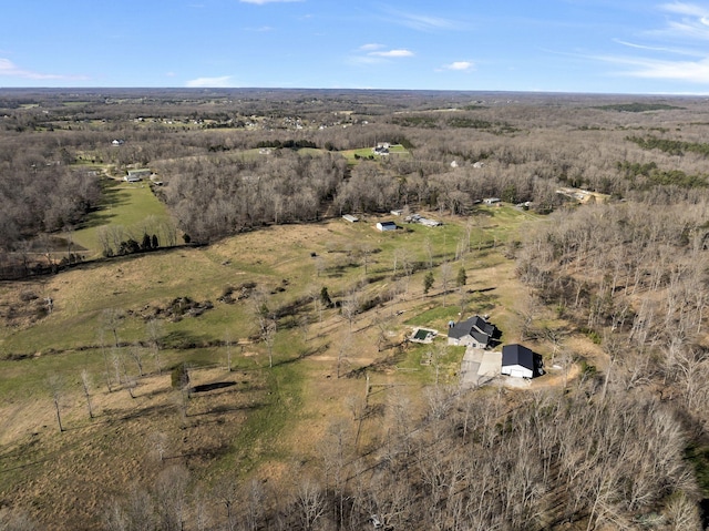 birds eye view of property with a rural view
