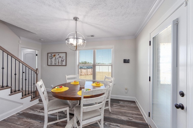 dining space featuring visible vents, wood finished floors, crown molding, and stairway