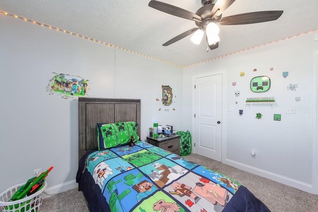 carpeted bedroom with baseboards, a textured ceiling, and ceiling fan