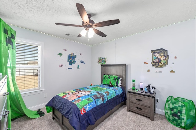 bedroom featuring visible vents, baseboards, light colored carpet, and a textured ceiling