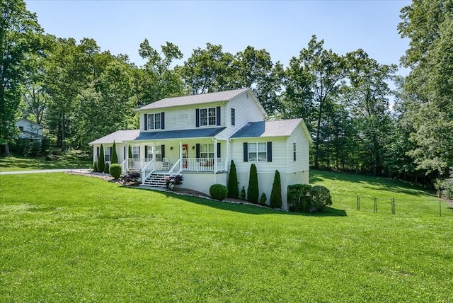 view of front of house featuring a front yard, a porch, and fence