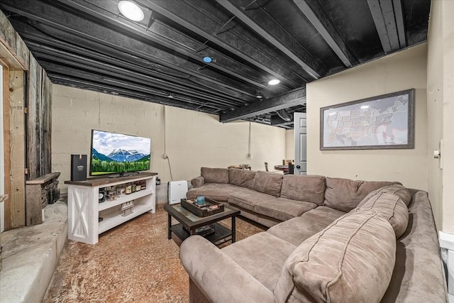 living room featuring unfinished concrete floors
