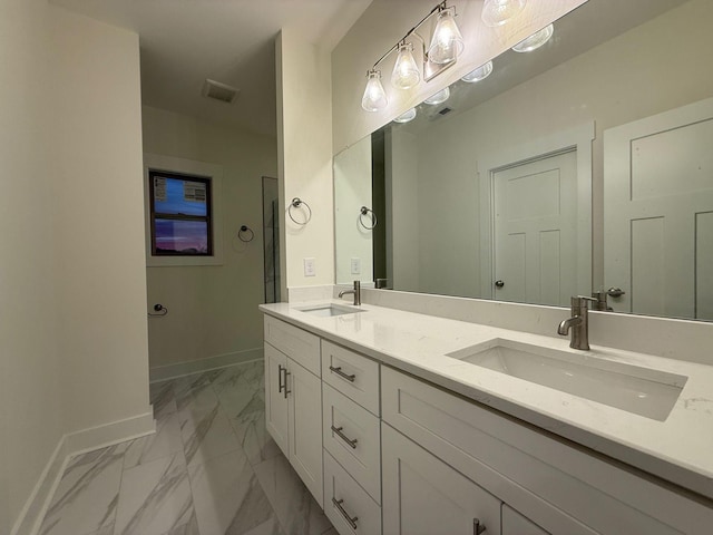 7132 Silverwood Trl, Hermitage, TN 37076 - bathroom with visible vents, marble finish floor, baseboards, and a sink