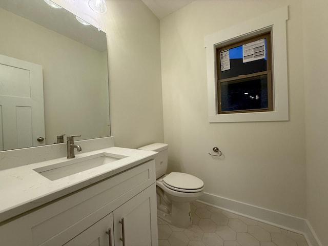 7132 Silverwood Trl, Hermitage, TN 37076 - half bathroom featuring tile patterned floors, baseboards, toilet, and vanity
