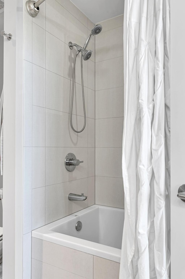 full bath featuring tiled shower / bath combo