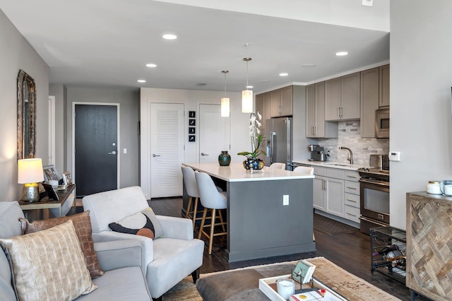 living room featuring recessed lighting and dark wood-type flooring