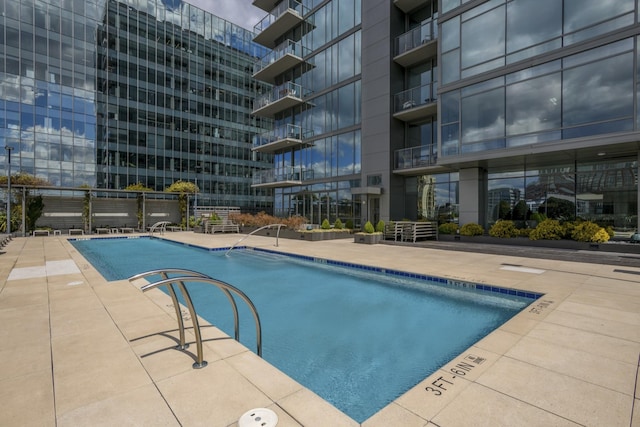 pool with a patio area