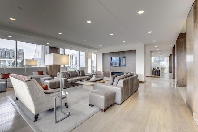 living room featuring recessed lighting and light wood-style flooring