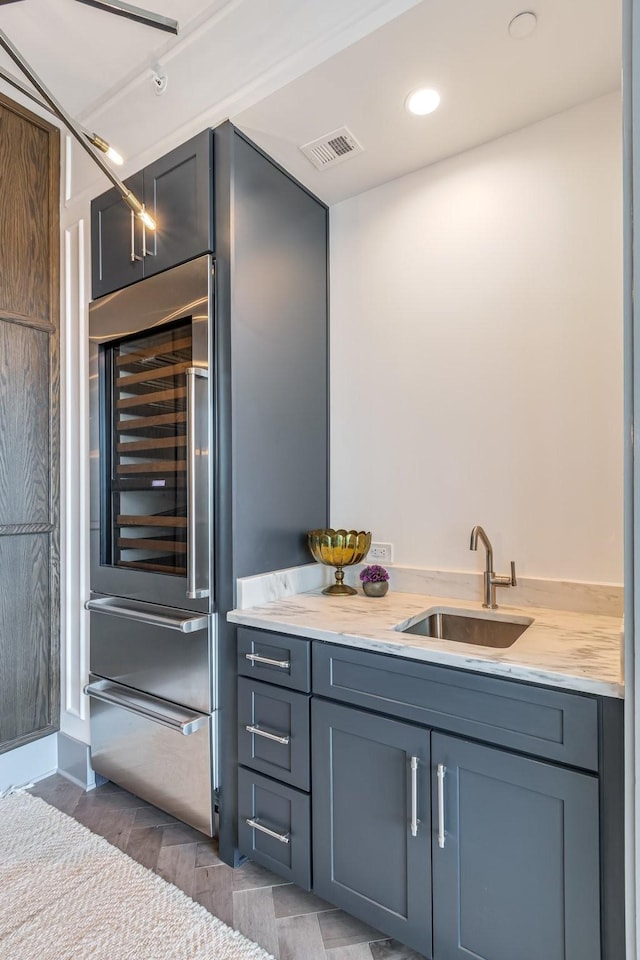 1616 W End Ave Unit 2602, Nashville, TN 37203 - bathroom with visible vents, recessed lighting, vanity, and wood finished floors
