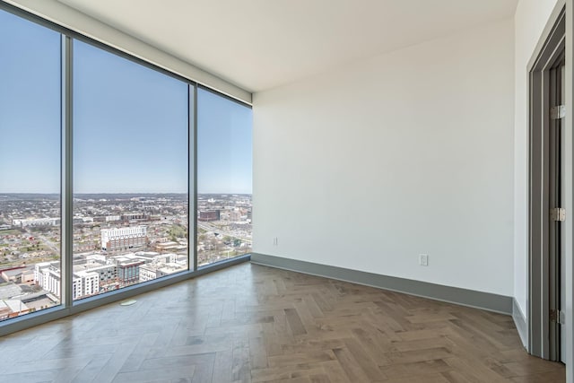 1616 W End Ave Unit 2602, Nashville, TN 37203 - empty room with baseboards, a view of city, and expansive windows