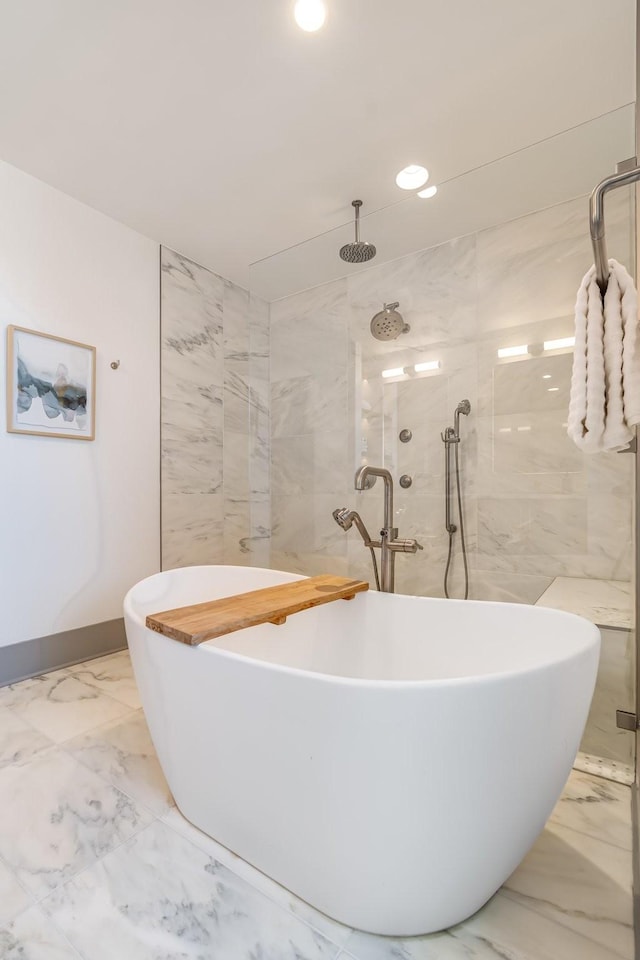 1616 W End Ave Unit 2602, Nashville, TN 37203 - bathroom with baseboards, recessed lighting, tiled shower, a soaking tub, and marble finish floor