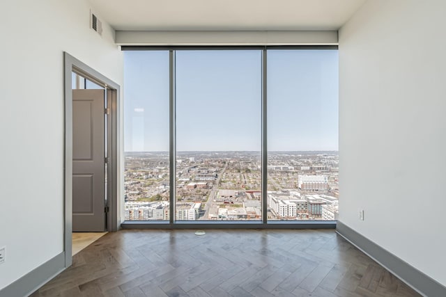 1616 W End Ave Unit 2602, Nashville, TN 37203 - empty room featuring a city view, visible vents, and baseboards